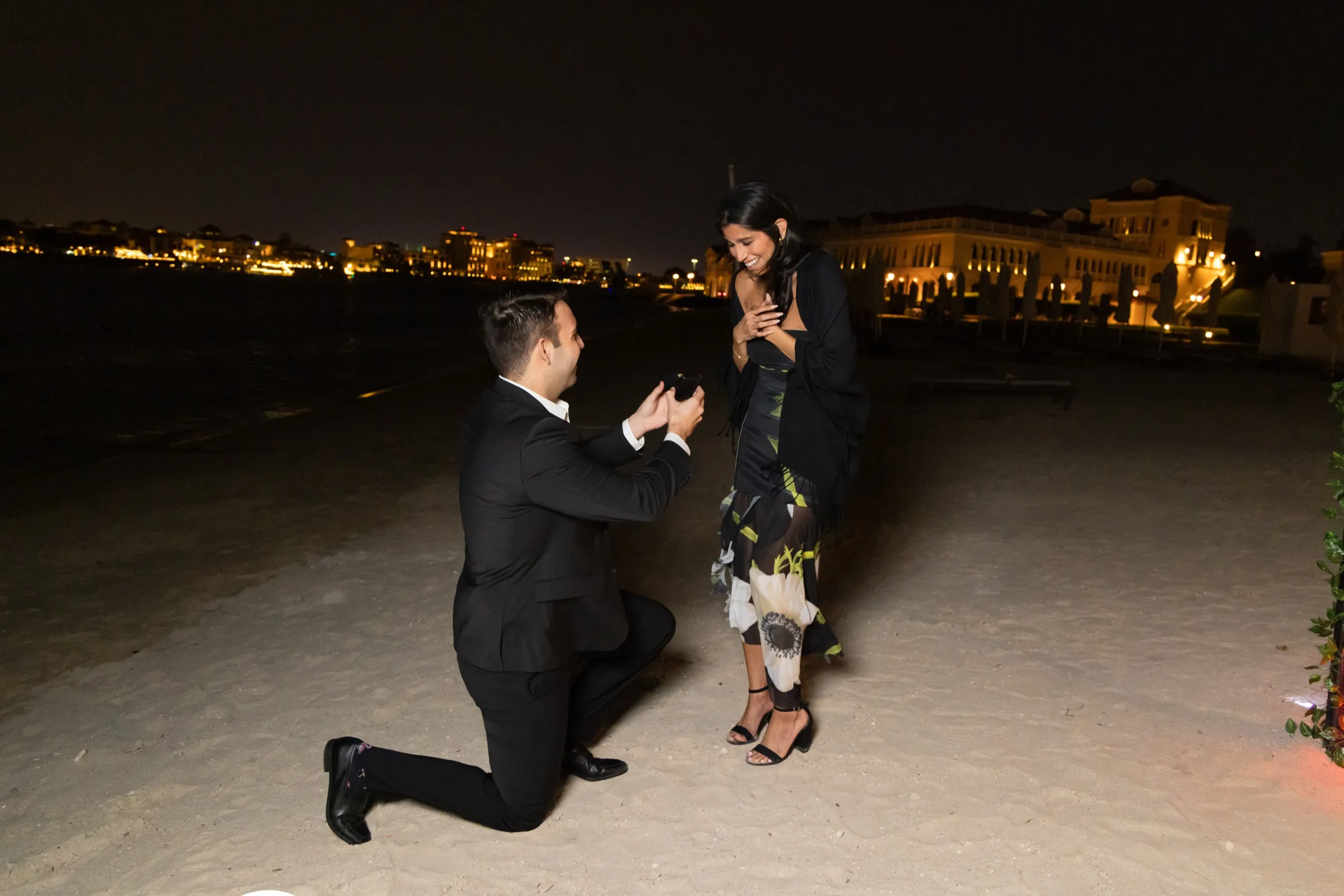 Beach proposal at night — private celebration