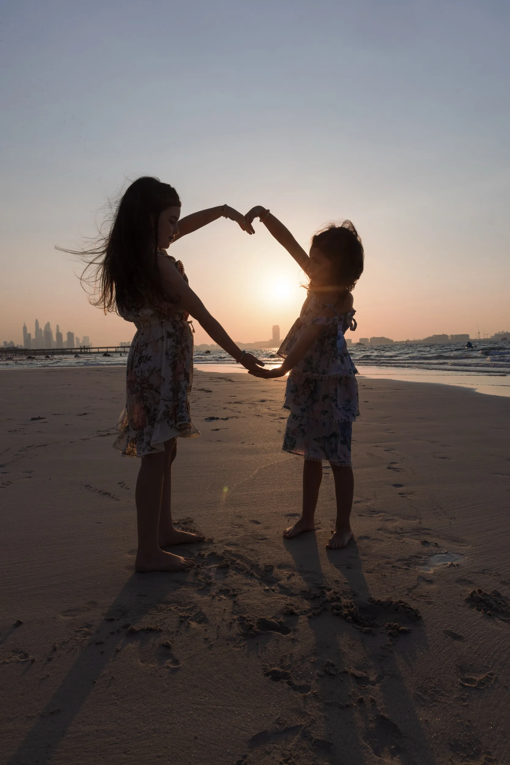 Private family moment — sunset beach silhouette