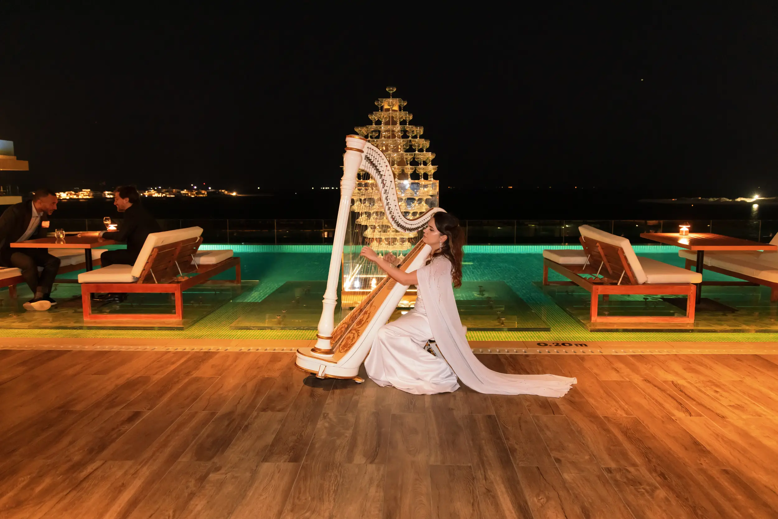Harpist by pool — private villa entertainment