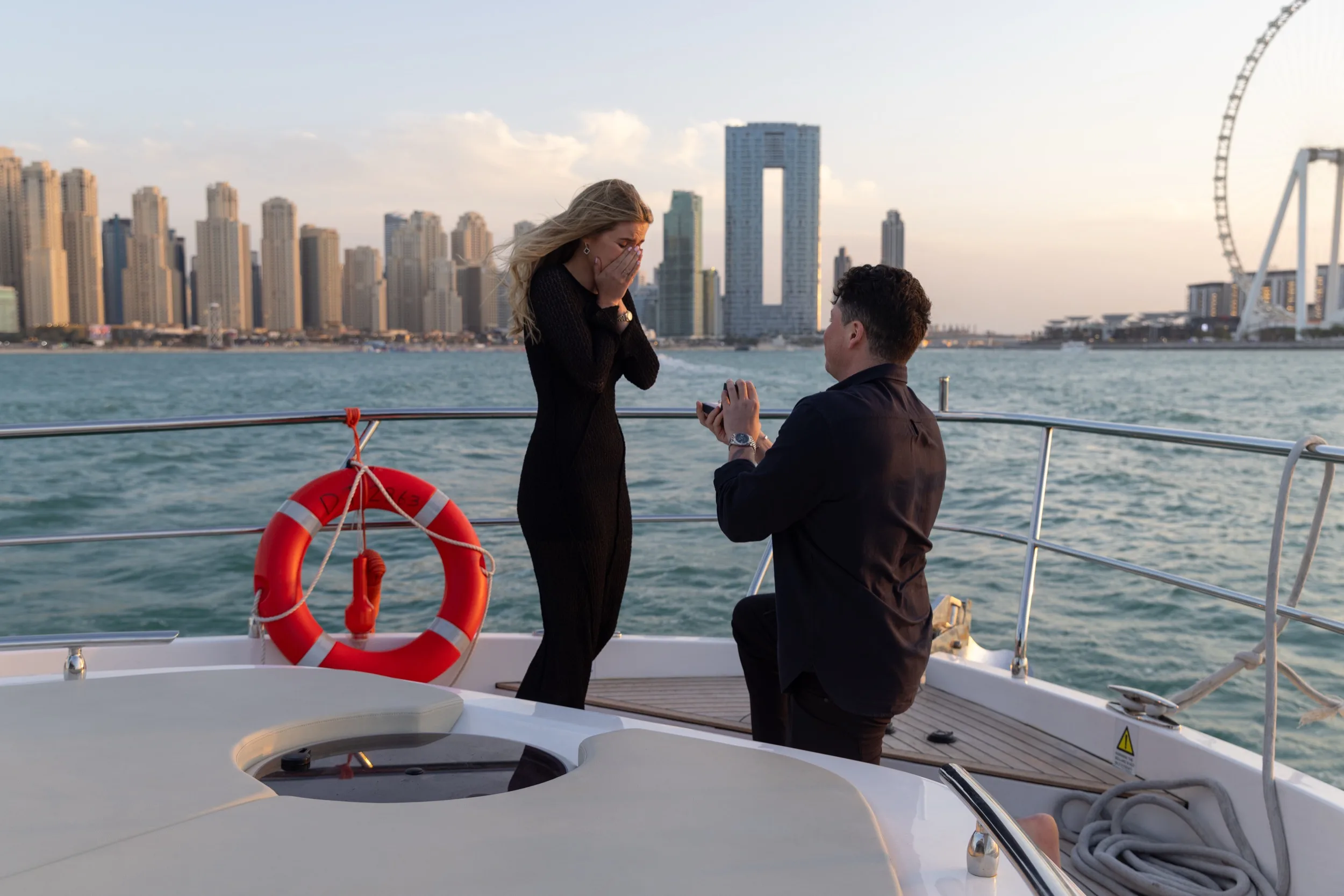 Private yacht proposal at sunset